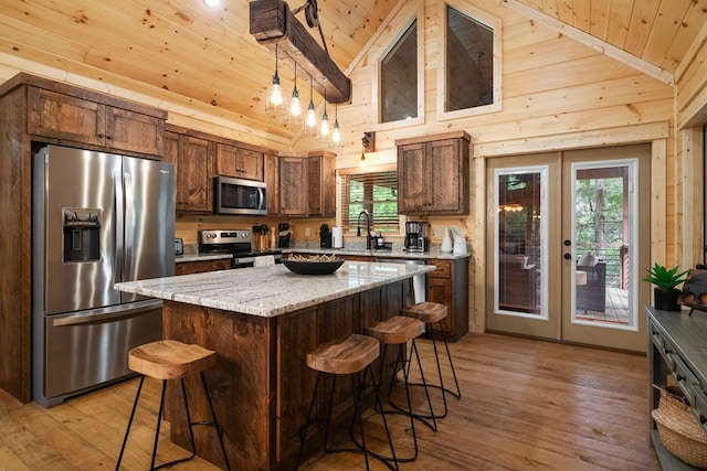 953 Lemmon Ln, Ellijay, GA 30540 - kitchen featuring stainless steel appliances, wood ceiling, french doors, light wood-type flooring, and a kitchen breakfast bar