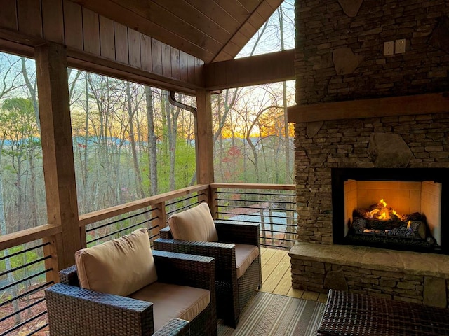 953 Lemmon Ln, Ellijay, GA 30540 - sunroom featuring an outdoor stone fireplace and vaulted ceiling