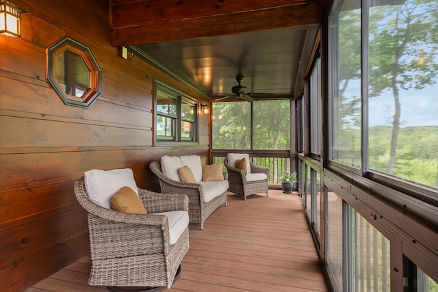 sunroom / solarium featuring ceiling fan