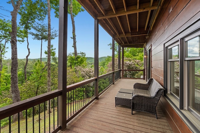 wooden deck featuring a mountain view
