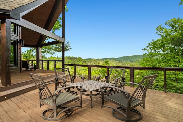 deck featuring outdoor dining area