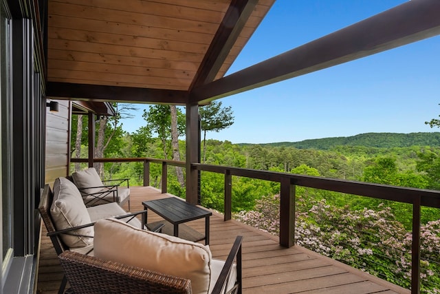 wooden terrace with a forest view