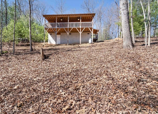 back of property featuring a wooden deck