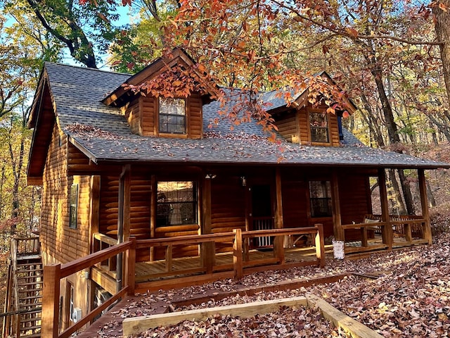 view of front of home featuring a porch and roof with shingles