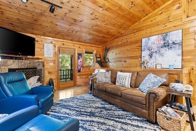 living room featuring wood walls, wood ceiling, vaulted ceiling, and hardwood / wood-style floors