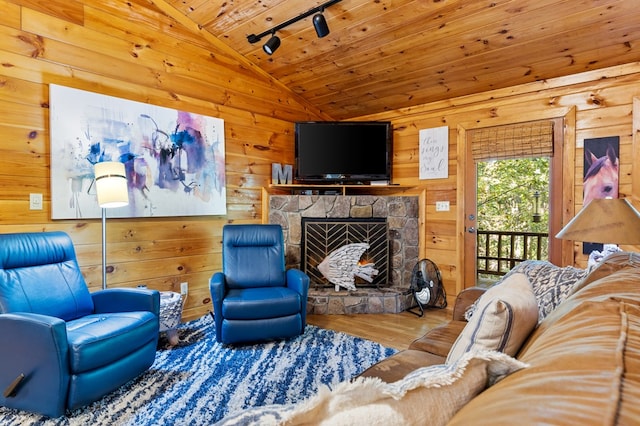 living room featuring vaulted ceiling, a fireplace, wooden ceiling, wooden walls, and hardwood / wood-style floors