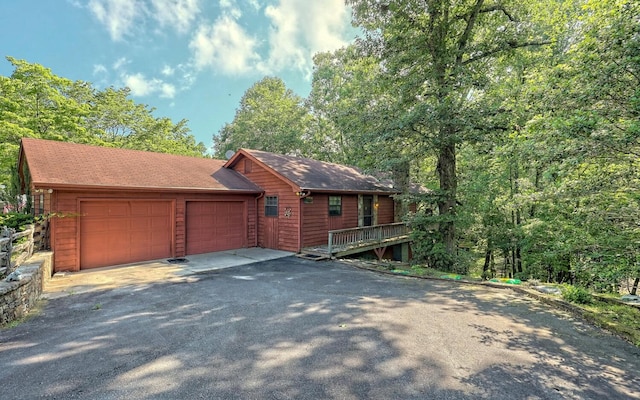 view of front facade featuring a garage and a deck