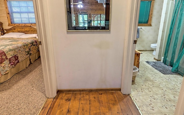 hallway with light hardwood / wood-style flooring