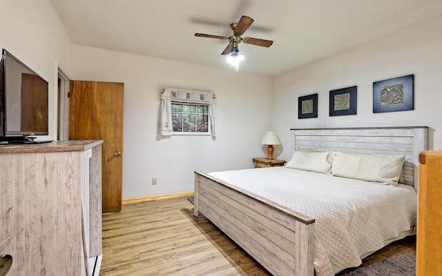 bedroom with ceiling fan and light hardwood / wood-style flooring