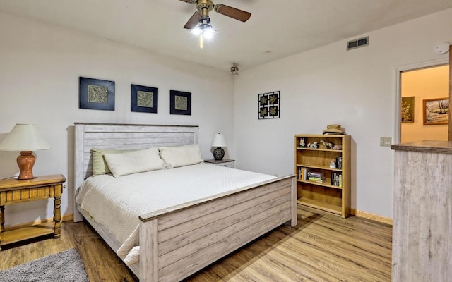 bedroom featuring ceiling fan and light hardwood / wood-style flooring