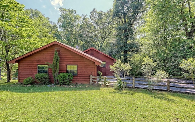 view of home's exterior with a yard