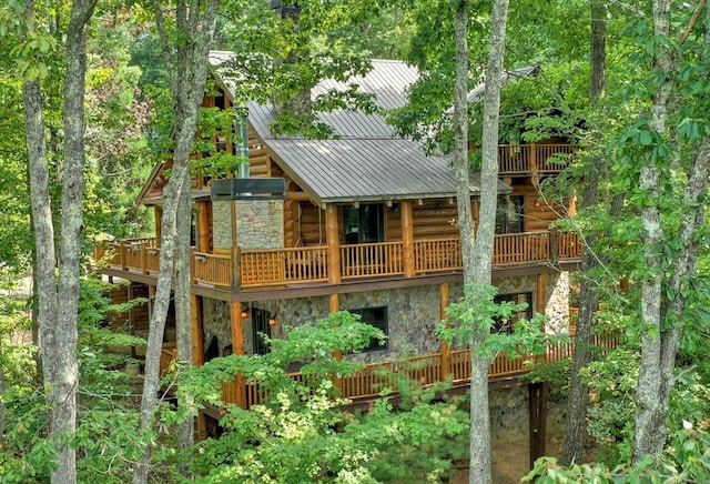 rear view of property with a balcony