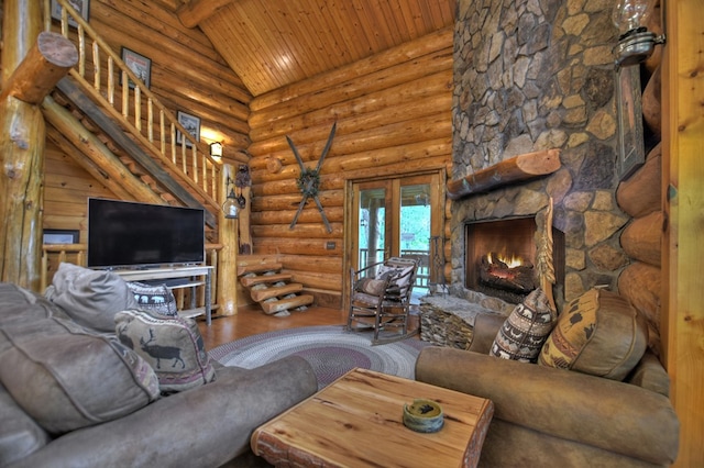 living room with wood ceiling, log walls, wood-type flooring, and a fireplace