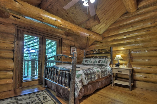 bedroom featuring wood ceiling, ceiling fan, lofted ceiling with beams, hardwood / wood-style flooring, and log walls