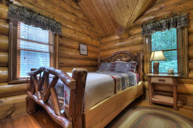 bedroom with lofted ceiling, rustic walls, wood-type flooring, and wood ceiling