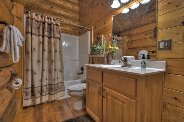 full bathroom featuring shower / bath combination with curtain, toilet, hardwood / wood-style flooring, and vanity