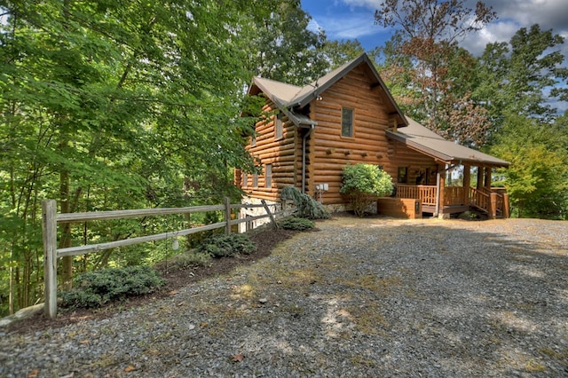 view of side of home with a wooden deck