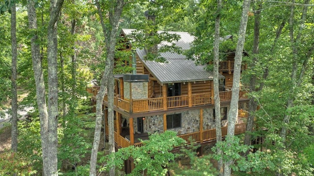 rear view of house featuring a balcony