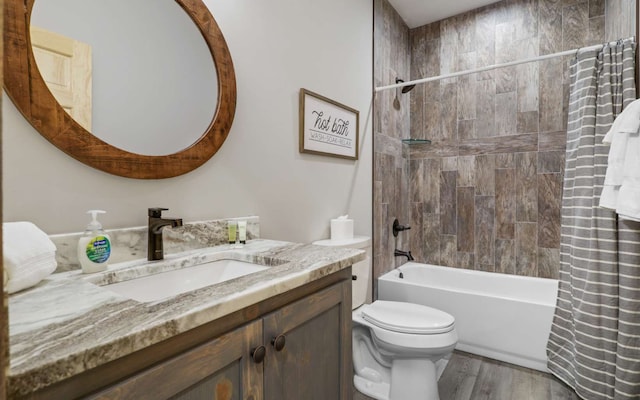 full bathroom featuring toilet, vanity, shower / tub combo, and hardwood / wood-style flooring