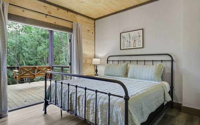 bedroom with crown molding, wooden ceiling, and hardwood / wood-style flooring