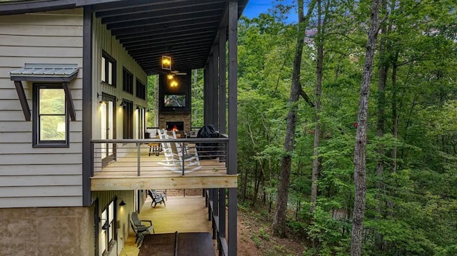 view of home's exterior featuring an outdoor stone fireplace