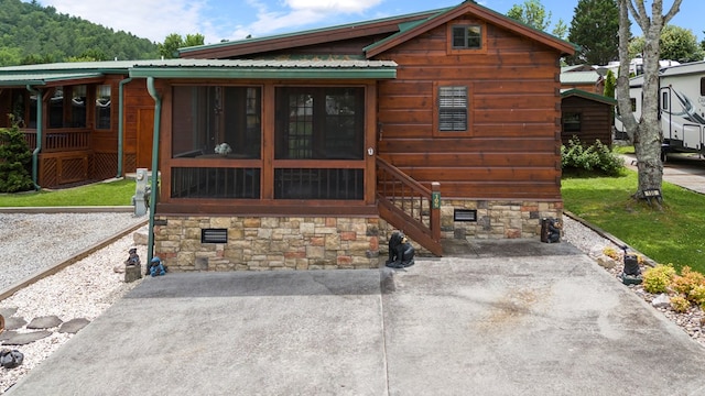 106 River Vista Dr, Dillard, GA 30537 - rear view of property with a metal roof and a sunroom