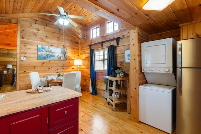 106 River Vista Dr, Dillard, GA 30537 - office featuring wood ceiling, stacked washer and clothes dryer, ceiling fan, wooden walls, and light wood-style floors