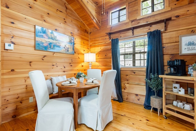 106 River Vista Dr, Dillard, GA 30537 - dining space with vaulted ceiling, wooden ceiling, plenty of natural light, wooden walls, and light wood-style floors