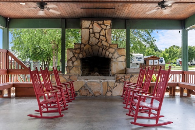 106 River Vista Dr, Dillard, GA 30537 - view of patio / terrace featuring a ceiling fan and an outdoor stone fireplace