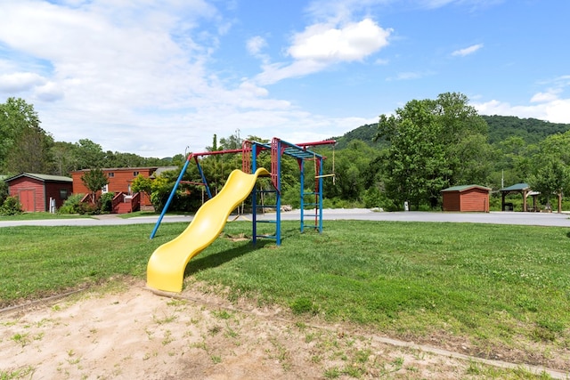 106 River Vista Dr, Dillard, GA 30537 - community play area featuring a storage unit and a lawn