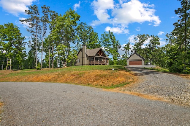 view of front of house featuring an outdoor structure and a garage