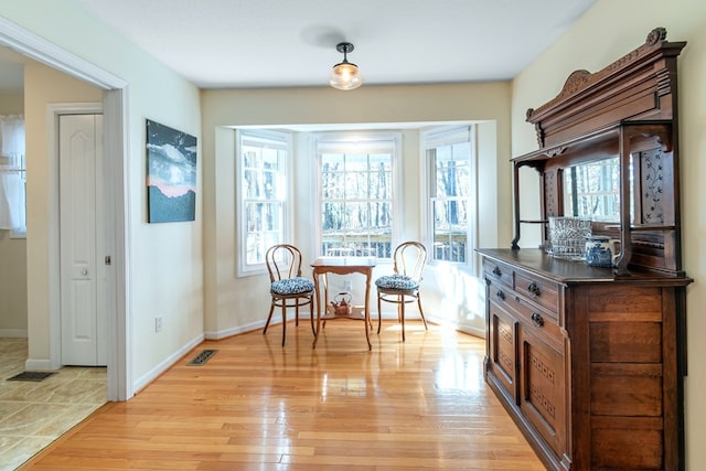 sitting room featuring light hardwood / wood-style flooring