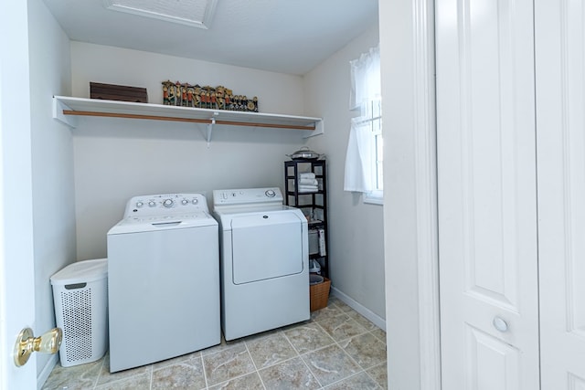 laundry room with washing machine and dryer