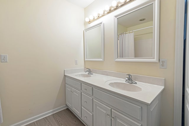 bathroom featuring vanity and wood-type flooring