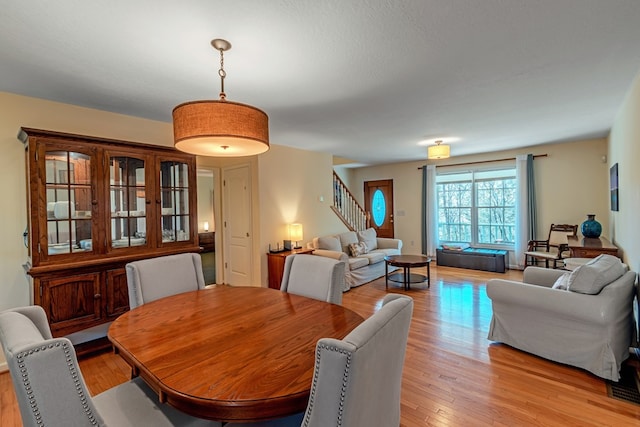 dining area featuring light wood-type flooring