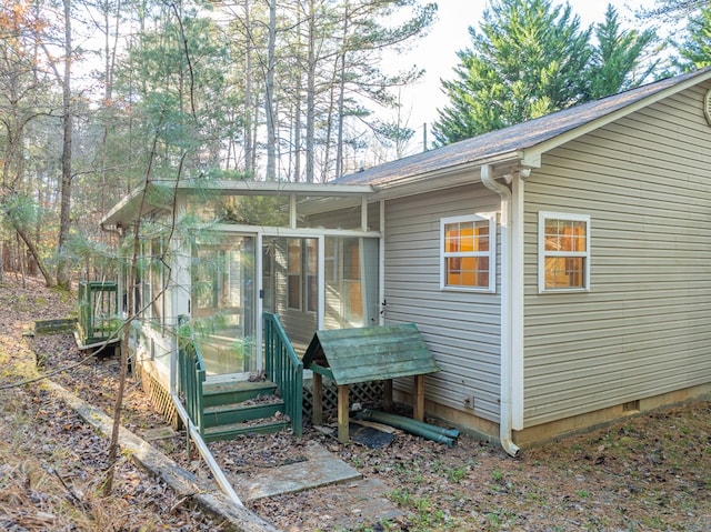 exterior space featuring a sunroom