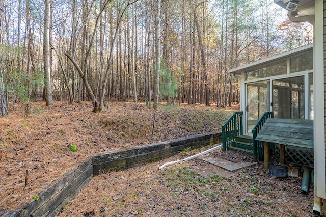 view of yard with a sunroom