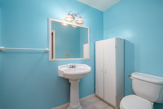 bathroom with toilet and a textured ceiling