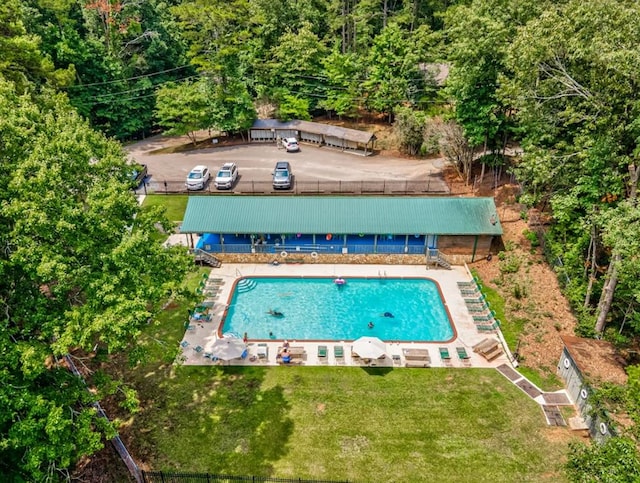 view of swimming pool with a lawn and a patio