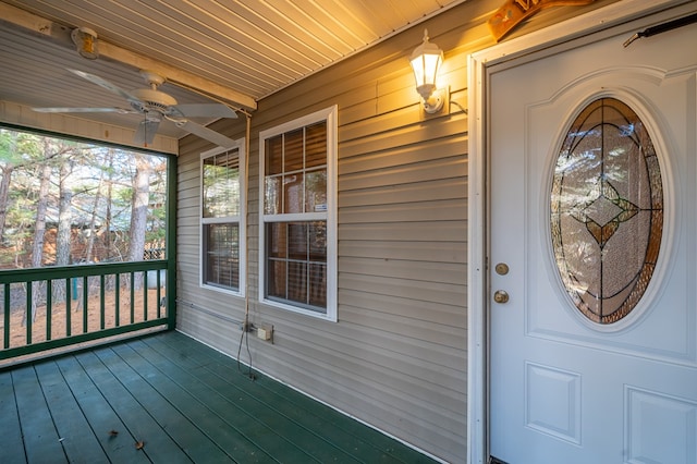 doorway to property featuring ceiling fan and covered porch