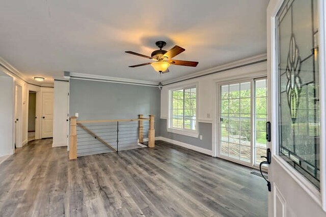 unfurnished room with crown molding, hardwood / wood-style floors, and ceiling fan