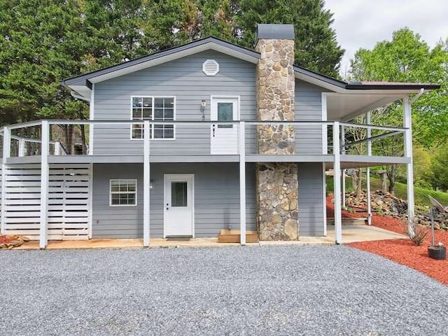 view of front of home featuring a carport