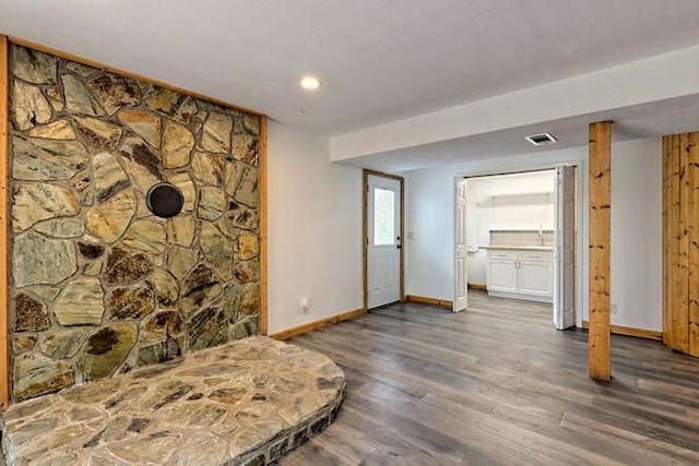 bedroom with dark hardwood / wood-style flooring