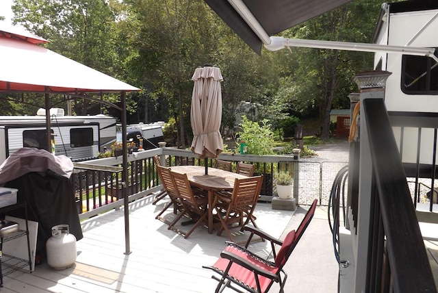 wooden deck featuring a gazebo