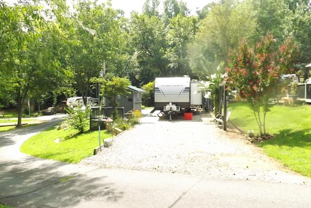 view of car parking featuring a yard