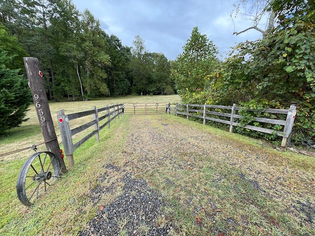 view of yard with a rural view