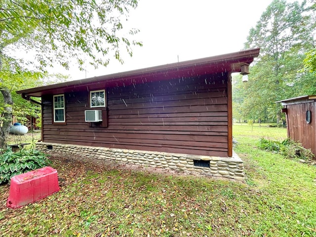 view of property exterior featuring a wall mounted air conditioner and crawl space