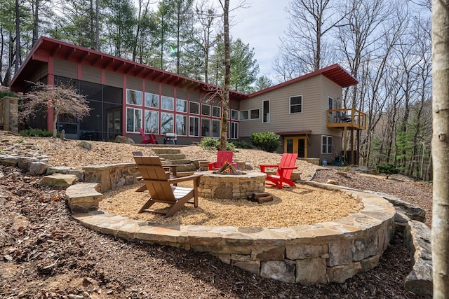 1181 Tickanetley Rd, Ellijay, GA 30536 - rear view of property featuring an outdoor fire pit, a sunroom, and french doors