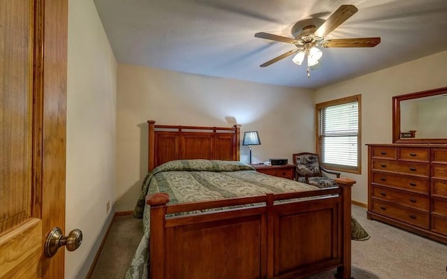 bedroom with light colored carpet and ceiling fan