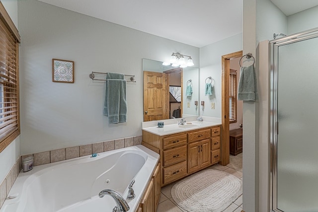 bathroom with vanity, tile patterned floors, and shower with separate bathtub